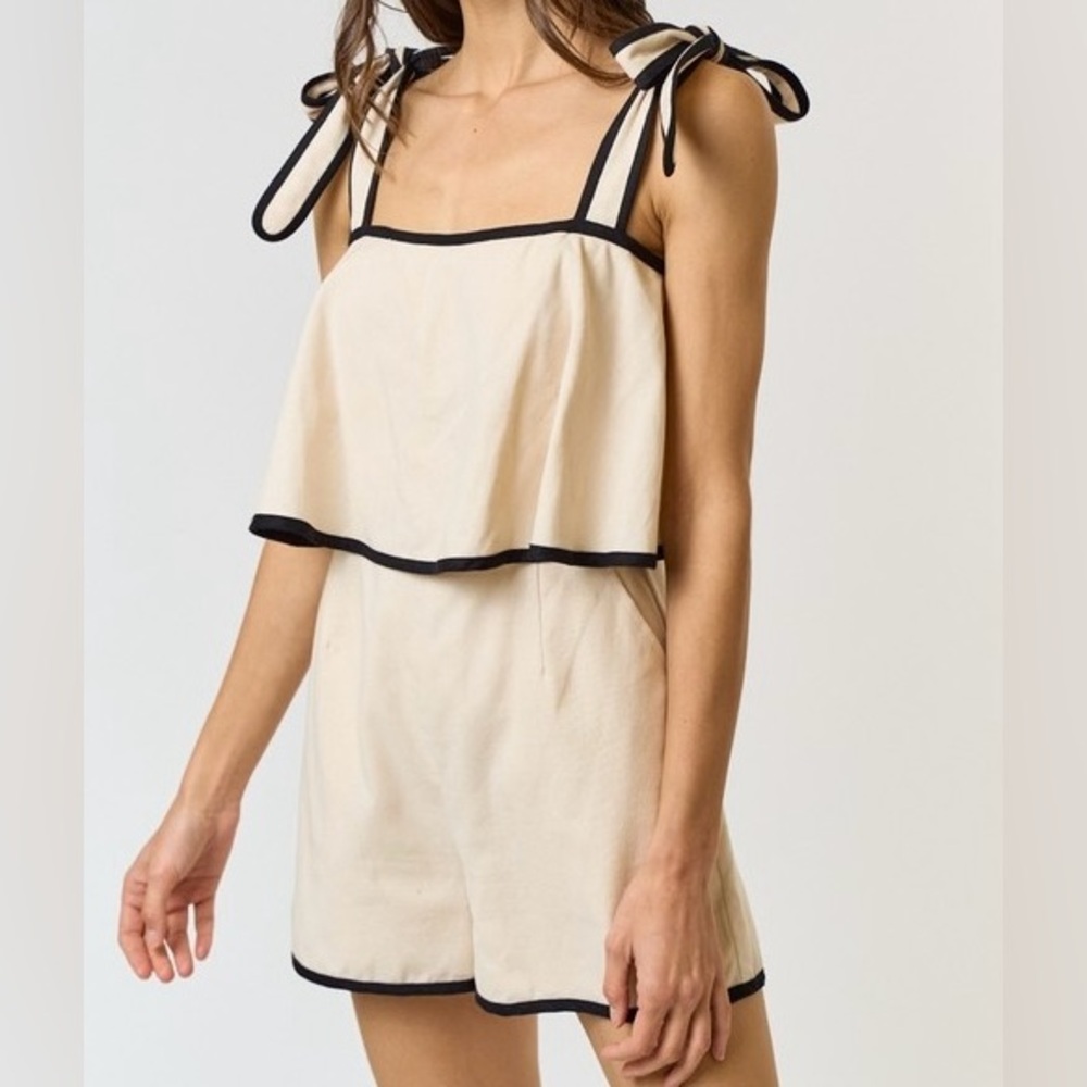 Chic Cream Romper with Black Trim